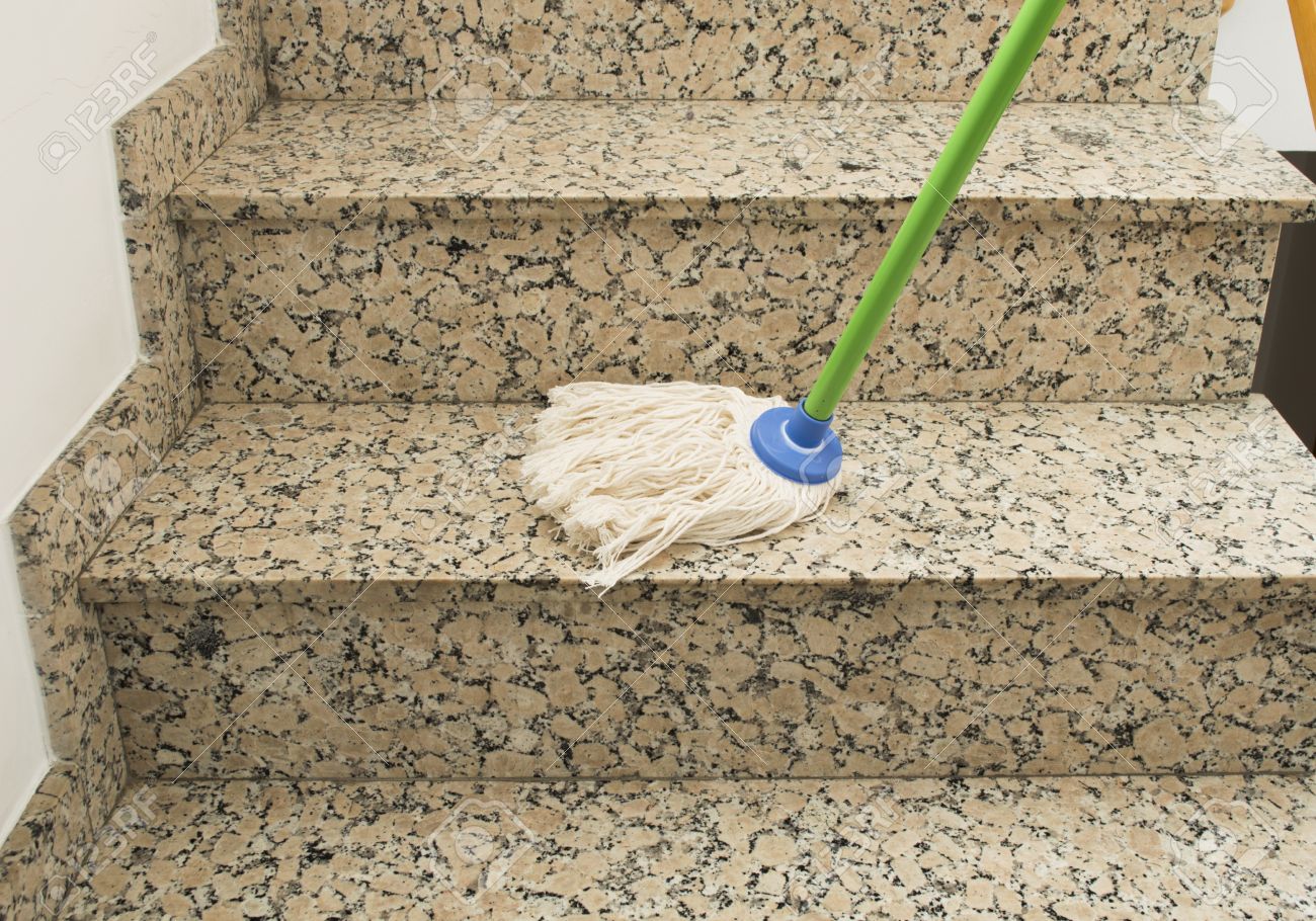18930086 mop cleaning the stairs marble